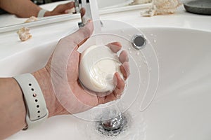 Soap in the hand of a man with Applewatch