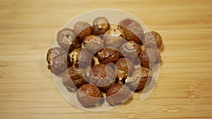 Soap nuts Indian soapberry or washnut, Sapindus mukorossi reetha or ritha from the soap tree shells are used to wash photo