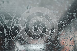 Soap suds on the glass. View from Inside car, automatic car wash. Background image and texture