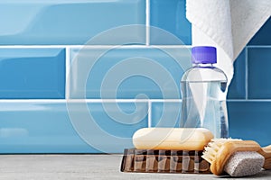 Soap and toiletries on shelf in blue bathroom