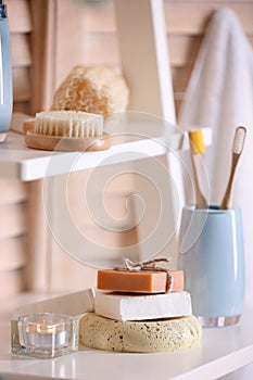 Soap and toiletries on wooden shelves