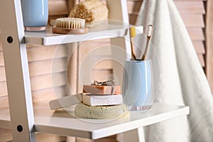 Soap and toiletries on wooden shelves