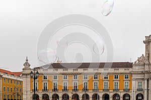 Soap water bubbles in PraÃÂ§a do ComÃÂ©rcio, Lisbon, Portugal photo