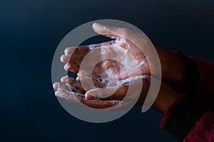 Soaped hands of a person - importance of washing hands during the coronavirus pandemic