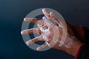 Soaped hands of a person - importance of washing hands during the coronavirus pandemic