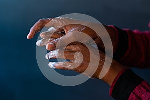 Soaped hands of a person - importance of washing hands during the coronavirus pandemic