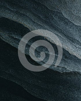 Soapstone close-up with natural ridge structure in dark gray layers photo