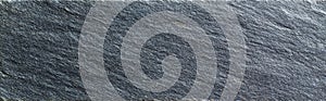 Soapstone slab with natural dark striations and honed matte texture photo