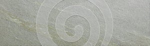 Soapstone surface in soft olive green tone with diagonal grain structure photo