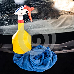 Soapy foggy spray bottle with rag. Cleaning tool for car wash