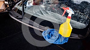 Soapy foggy spray bottle with rag. Cleaning tool for car wash