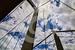 Soaring towers of a suspension bridge against sky