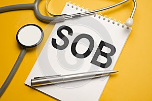 sob word and stethoscope on light white background