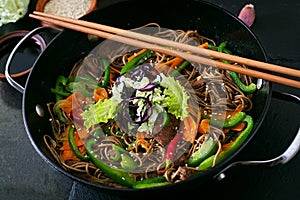 Soba noodles with beef, carrots, onions.