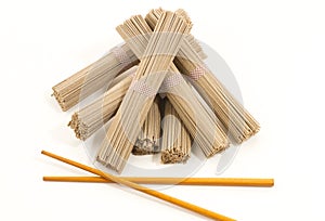 Soba noodles whit chopsticks on white background