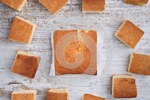 Sobaos pasiegos on an old wooden table