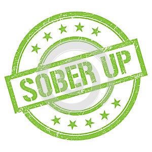 SOBER UP text written on green vintage stamp