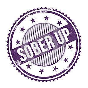 SOBER UP text written on purple indigo grungy round stamp