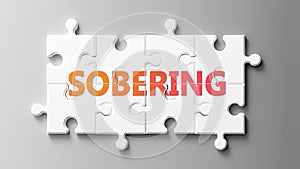 Sobering complex like a puzzle - pictured as word Sobering on a puzzle pieces to show that Sobering can be difficult and needs