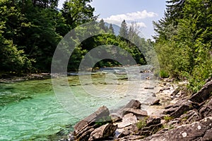 Soca - Emerald green water of Soca river in Bovec, Triglav National Park, Slovenia