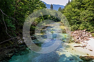 Soca - Scenic view of green hills and Soca river in Bovec, Triglav National Park, Slovenia