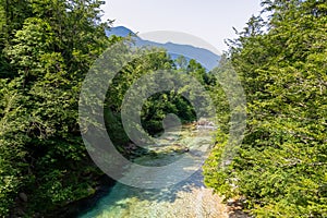 Soca - Scenic view of green hills and Soca river in Bovec, Triglav National Park, Slovenia