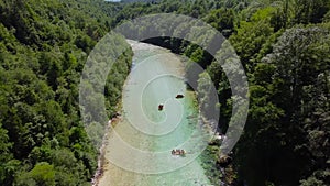 Soca Valley, Slovenia - 4K Aerial shot of white water rafting on River Soca. Whitewater rafting teams going down River Soca