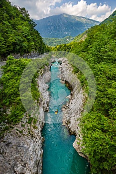 Soca Valley, Slovenia - River Soca with kayaker. Beautiful turquoise water river in the Slovenian Alps located at town of Kobarid
