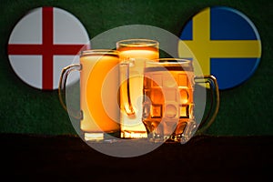 Soccer 2018. Creative concept. Beer glasses with beer on table ready to drink. Support your country with beer concept.