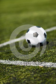 Soccer ball on artificial pitch