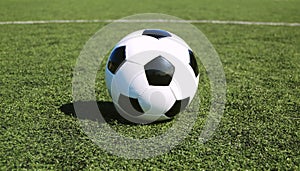 Soccer ball on astro turf photo