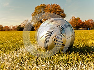 Soccer ball on an autumn field