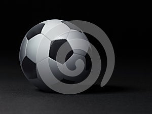 Soccer ball on black background