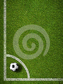 Soccer ball in corner kick position football field top view