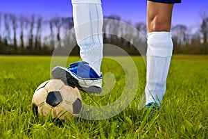 Soccer ball and feet of player