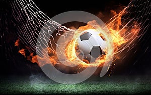 A soccer ball on fire in the goal net with flames