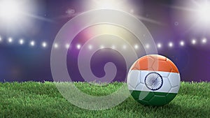 Soccer ball in flag colors on a bright blurred stadium background. India.
