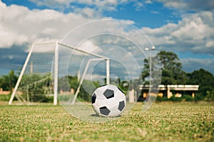 A soccer ball fon the green grass field