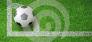 Soccer ball or Football on corner angle line of green artificial grass soccer field.