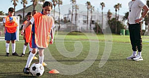 Soccer ball, girl and training for game and sport drill for workout and exercise on school field. Students, coaching and