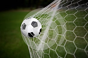 Soccer ball in goal photo