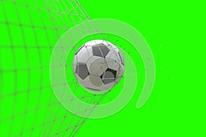 soccer ball in goal with grass leaves that raises effect on chroma key green screen background, concept of competition and