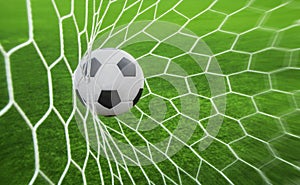 Soccer ball in goal photo