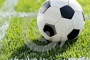 Soccer ball on grass in corner kick position on soccer field stadium