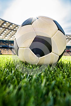 Soccer ball on grass on soccer field stadium