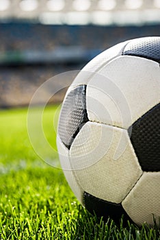 Soccer ball on grass on soccer field stadium