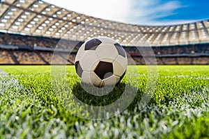 Soccer ball on grass on soccer field stadium