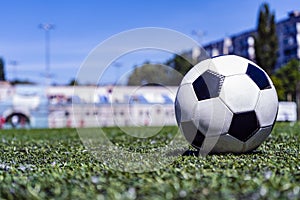 Soccer ball on grass in soccer stadium