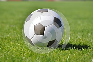 Soccer ball on ground grass stadium football game sport competition event championship match artificial green grass lawn