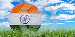 Soccer ball with Indian flag on the green grass against blue sky, 3D rendering